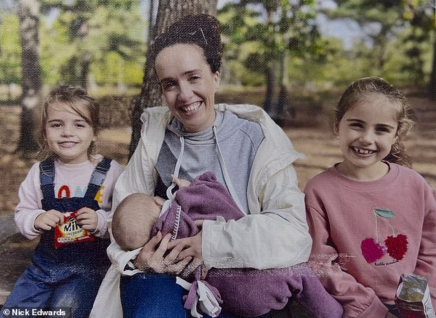 Becky Sharp (center) pictured holding her daughter Lorena before the collision.  She is sitting in a park with her daughters Matilda (left) and Finnula (right)