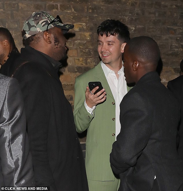 Stylish: Asa Butterfield, 26, who plays Otis Milburn in the Netflix series, stood out in a striking green pinstripe suit