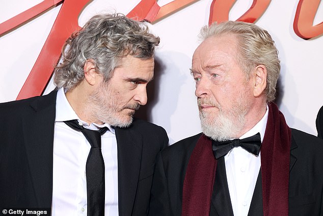 Joaquin Phoenix and director Ridley Scott attend the 'Napoleon' world premiere at Salle Pleyel on November 14, 2023 in Paris