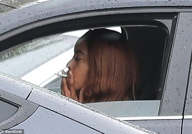 Barack and Michelle's eldest daughter was also seen puffing on a cigarette in her car after lunch