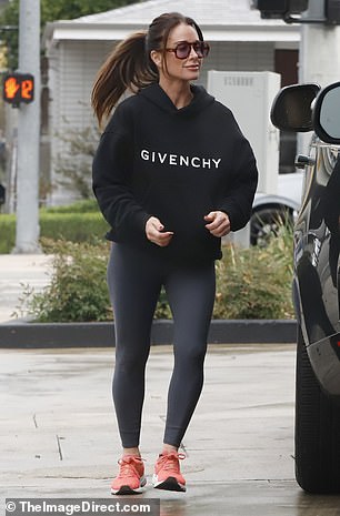 Sweatshirt swap: The Real Housewives of Beverly Hills star rocked what appeared to be the same black Givenchy hoodie the country music crooner had worn during their walk on Tuesday