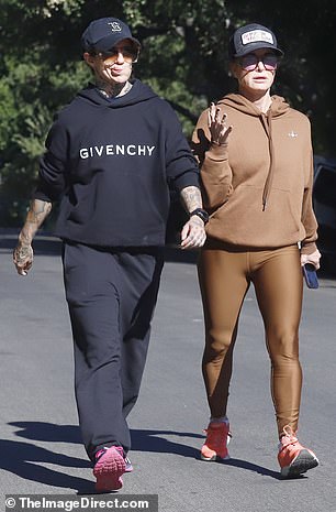 Sweatshirt swap: The Real Housewives of Beverly Hills star rocked what appeared to be the same black Givenchy hoodie the country music crooner had worn during their walk on Tuesday