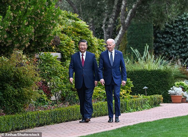 Chinese President Xi Jinping and US President Joe Biden take a walk after their talks at the Filoli Estate outside San Francisco