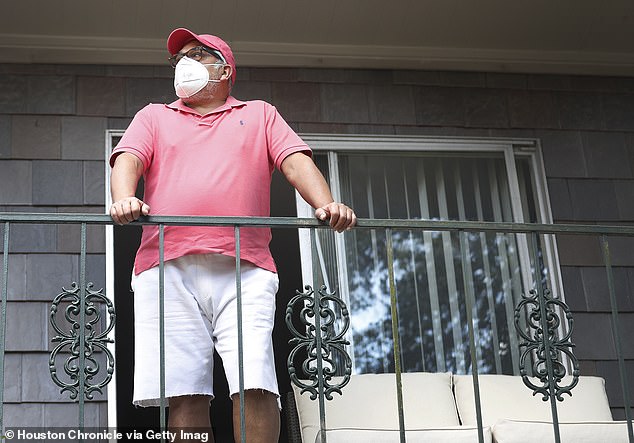 Covid lockdowns forced the country into isolation.  Here is Jose Guerra standing on his balcony in Houston during a quarantine period