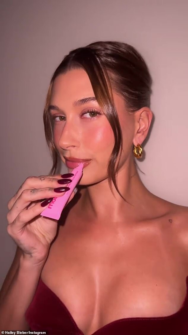 Think pink: The video showed her applying Rhode's new limited-edition Peptide lip tint