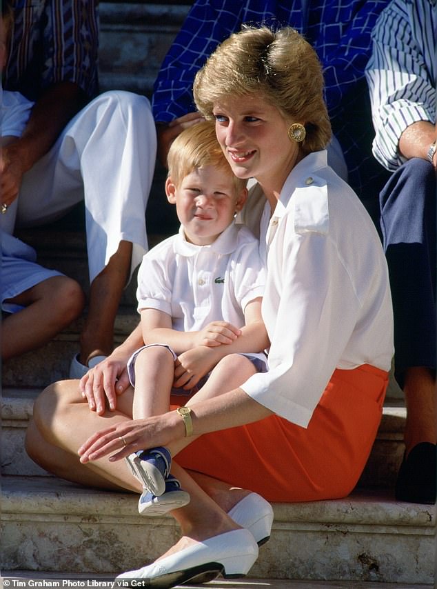 Prince Harry cuddles with his mother Princess Diana on the steps of the Marivent Palace in Palma, Spain.  in 1988