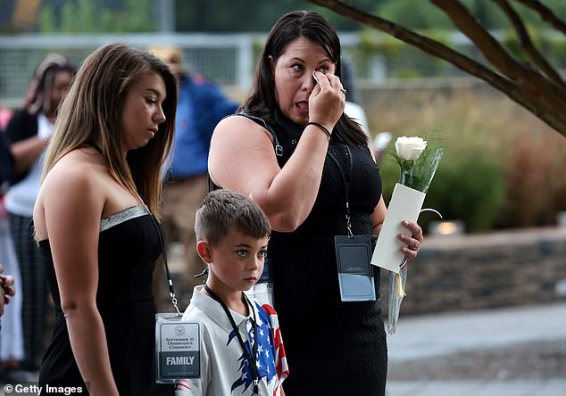 Relatives of victims attend a ceremony observing the 9/11 terrorist attacks on the Pentagon