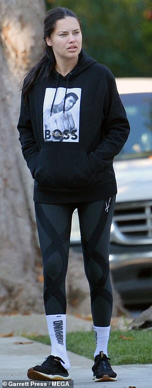 Brazilian beauty: The 42-year-old Brazilian model wore a black hoodie, matching leggings and black sneakers while walking with her boyfriend Andre Lemmers and their dog in Los Angeles