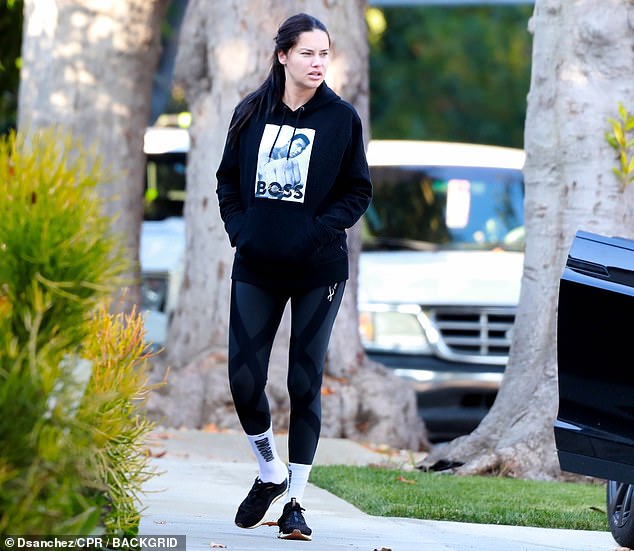 Sporty look: Adriana wore a Boss sweatshirt with a picture of Muhammad Ali