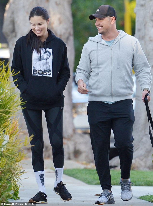 Sporty style: Andre kept it simple in a gray hoodie, black sweatpants and gray sneakers