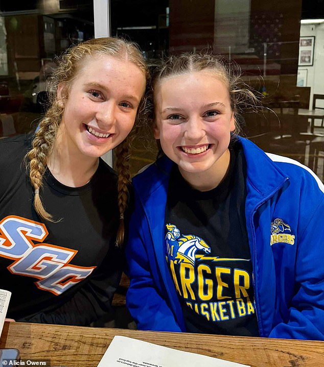 Ruby Hayes (right), 13, was having dinner with her family and friend Ava Owens (left) after a school basketball game when the deer crashed through the front window of the Grind Restaurant