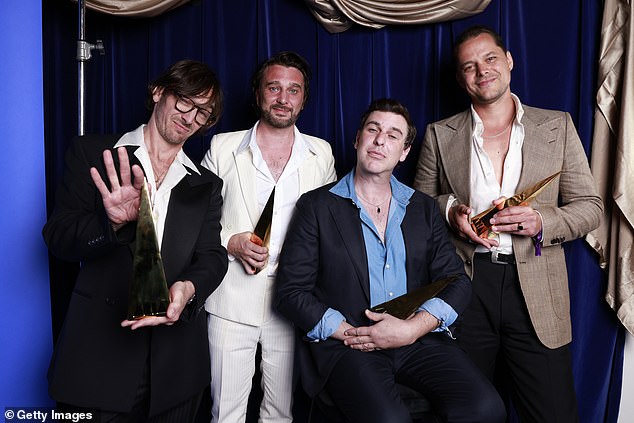 The veteran band – which includes frontman Nic, drummer Chris Cester, bassist Mark Wilson and guitarist Cameron Muncey – celebrated their induction into the ARIA Hall of Fame at the awards ceremony (photo L-R: Jet's Nic Cester, drummer Chris Cester, bassist Mark Wilson and guitarist Cameron Muncey)