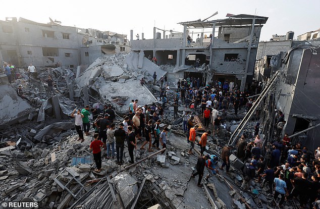 Palestinians search for victims in the Magazi refugee camp in central Gaza