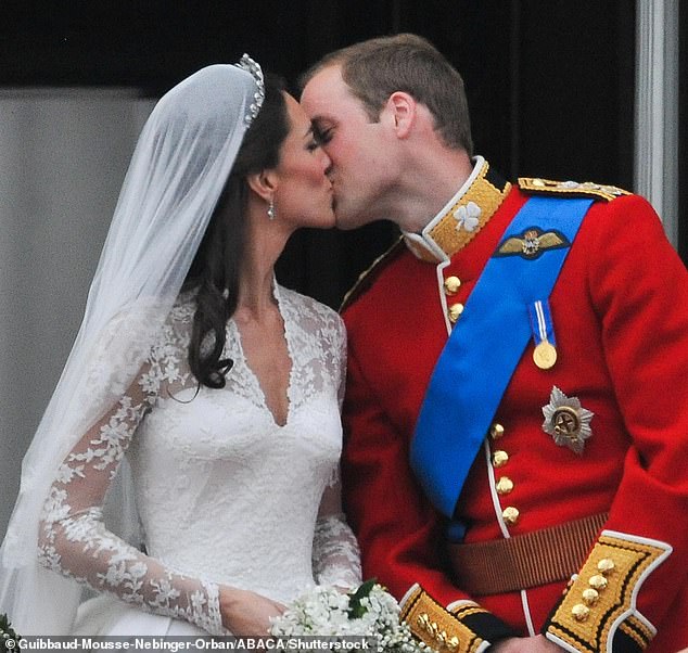 Prince William and his bride Princess Catherine appear on the balcony of Buckingham Palace