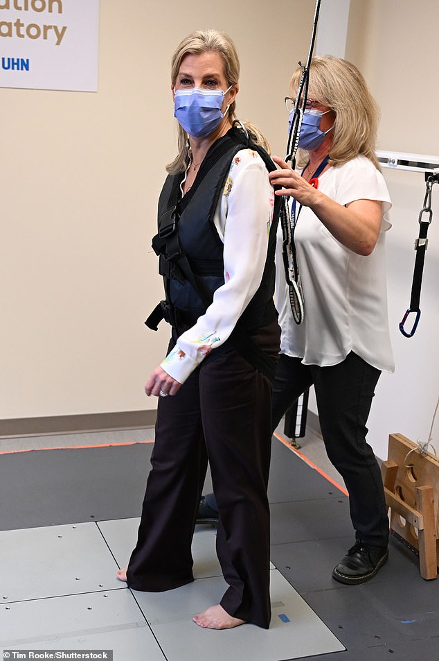 Showing she's a good sport, Sophie took off her pumps to try out the equipment at the Toronto Rehabilitation Institute in Canada last week