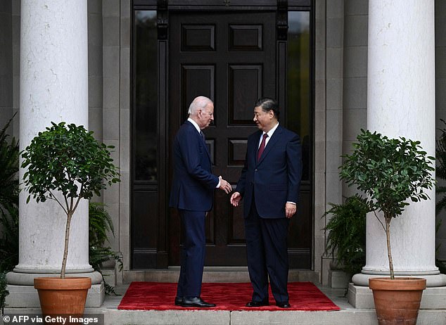 Biden reaches for Xi's hand at the entrance to the Filoli estate