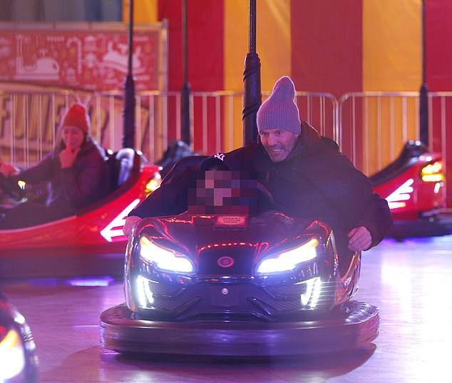 This way!  Jason let his son take the wheel as they drove across the crash floor