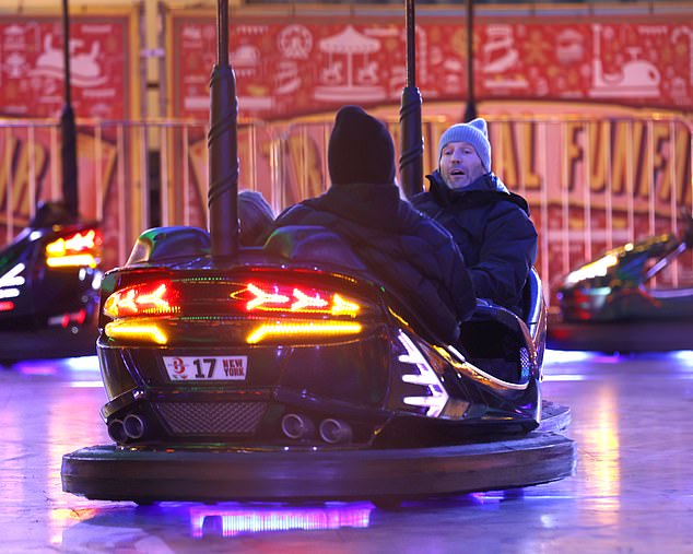 Game on: The couple, who got engaged in 2016, appeared to be joined by a number of other friends as they all went wild on the bumper cars