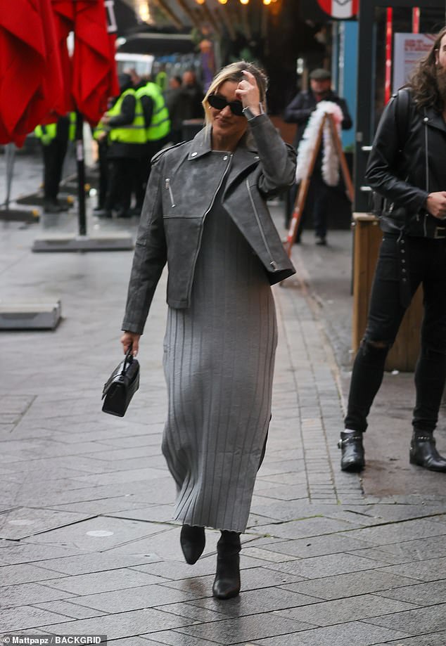 Chic: Elsewhere, her co-star Ashley Roberts, 42, opted for a stylish gray knitted midi dress and knee-high boots