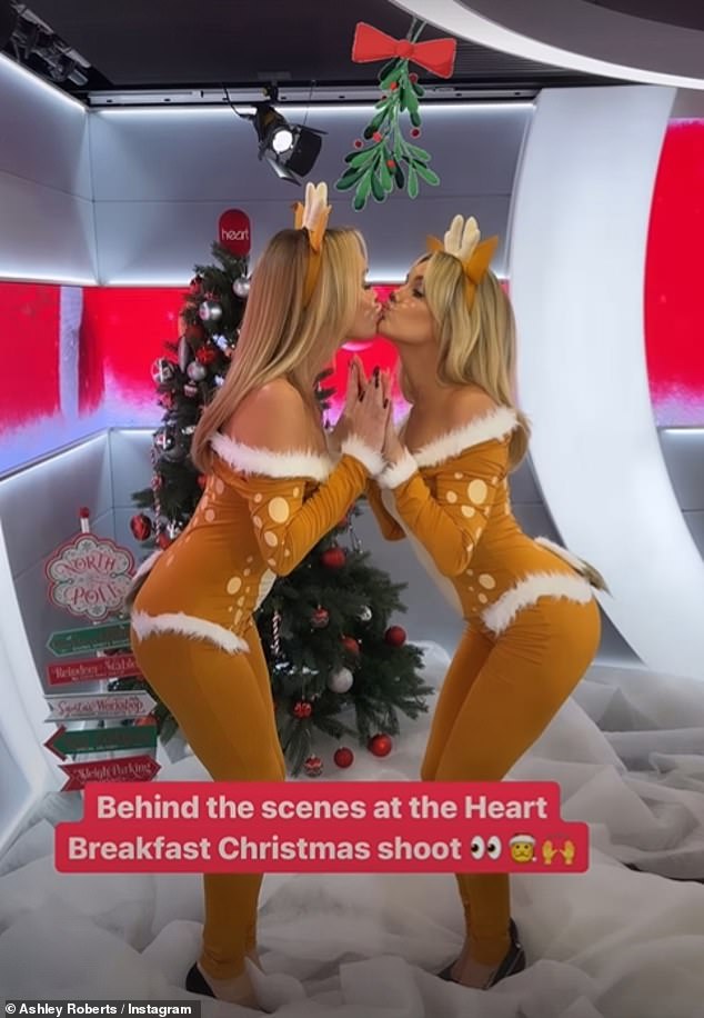 Festive: The presenters looked incredible as they donned skintight reindeer costumes with white fur as they kissed under the mistletoe