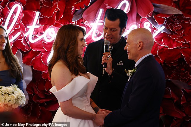 An Elvis impersonator led the ceremony, which took place in the paddock in Vegas