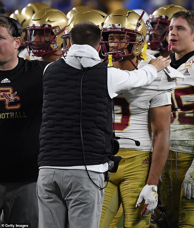 Johnson (second from right) was ejected from the game and assessed a 15-yard personal foul penalty on the play