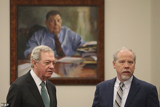 Attorney Dick Harpootlian (left) speaks with prosecutor Creighton Waters (right), who is expected to argue that Murdaugh killed his wife and son to distract from his alleged financial crimes