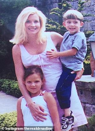 She is pictured here with her two children in an old photo