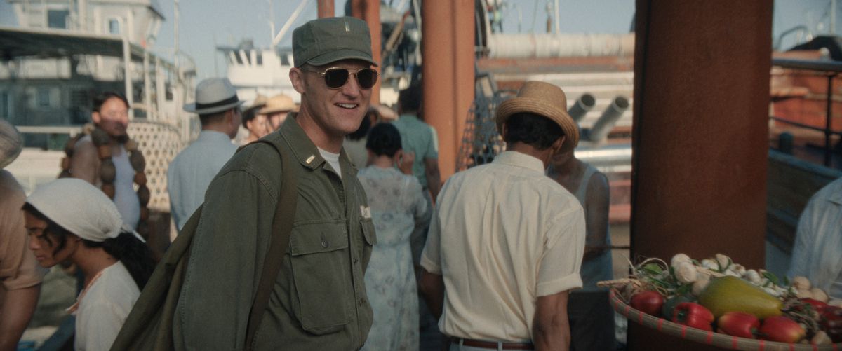 Wyatt Russell, dressed in a military uniform, smiles in Monarch: Legacy of Monsters.