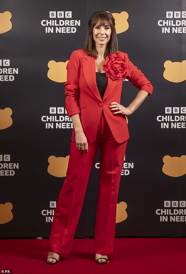 Smart: Alex Jones also appeared on stage during Children In Need, cutting a sophisticated figure in a red suit