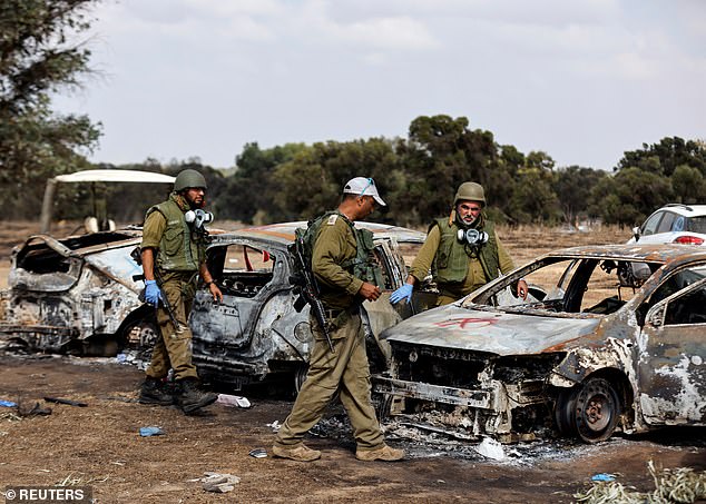 Israeli police investigators raised the death toll from the Nova music festival last night to 364 - after previously saying 270 people had been killed at the event.  Pictured: the devastating remains of the festival