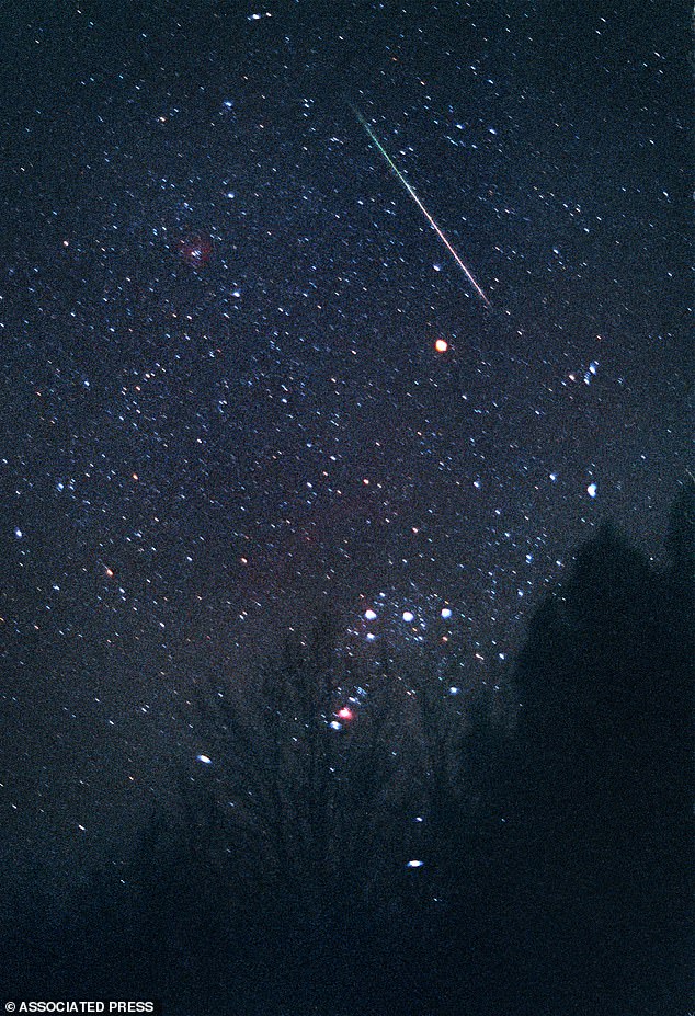 SCENE: Astronomers say up to 10 meteors could be seen every hour as Earth passes through the tail of Comet Tempel-Tuttle