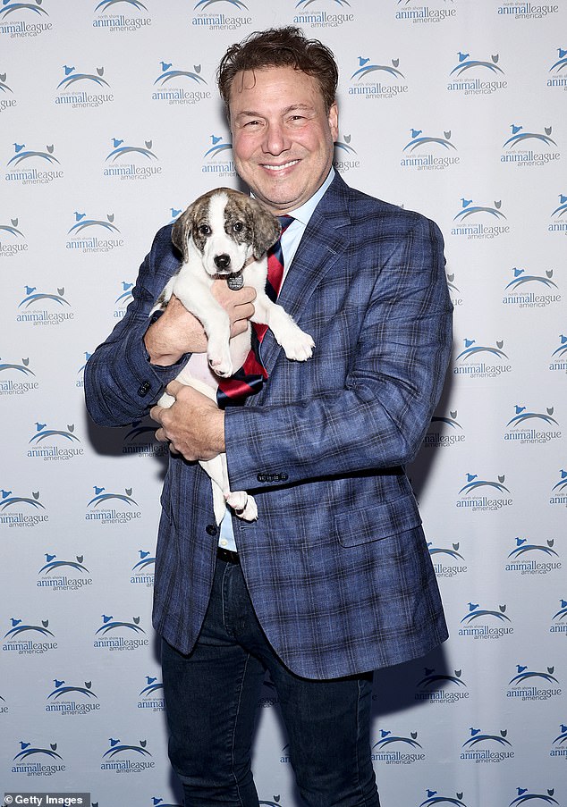Sweet: Celebrity chef Rocco DiSpirito, 56, showed his love for animals at the event