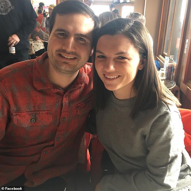 When her daughter got hungry halfway through the ride, Emily (seen with her husband) started feeding her.  But as she did so, the boat plunged down a 25-foot hill as the ride's camera snapped a photo