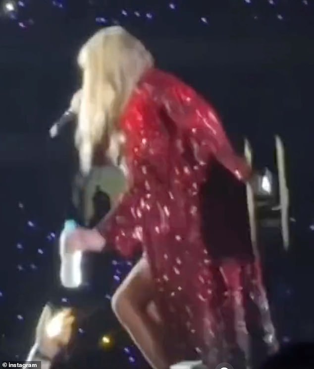 Scorching: In another video, Taylor was captured throwing a water bottle at an adoring fan in the crowd amid the sweltering heat