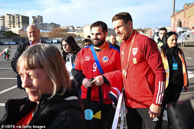 Wales captain Aaron Ramsey posed for a photo with a fan outside the Vazgen Sargsyan Republican Stadium ahead of the huge match