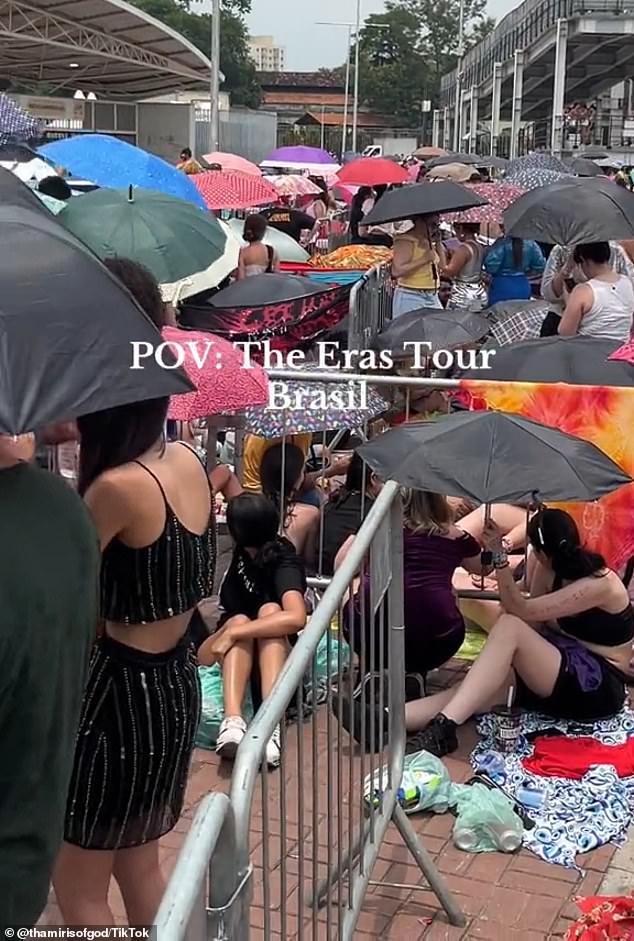 Scantily clad fans were seen huddled under umbrellas and rushing for ice to try and cool off amid Brazil's sweltering heatwave