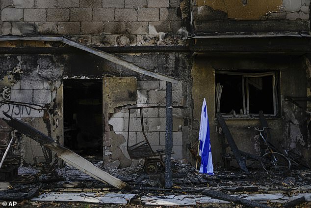 An Israeli flag is placed next to a house destroyed by Hamas terrorists during the October 7 attack on Kibbutz Be'eri, Israel (File Photo)