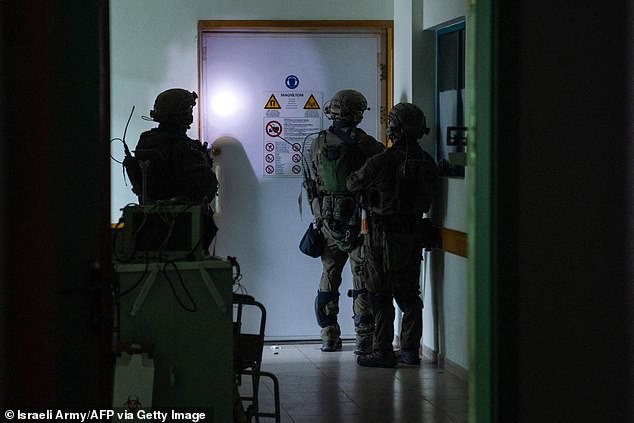 Israeli soldiers carry out operations at Al-Shifa Hospital in Gaza City, a photo released by the IDF shows