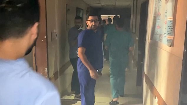 Video footage appears to show doctors evacuating patients from Al Shifa Hospital during a raid