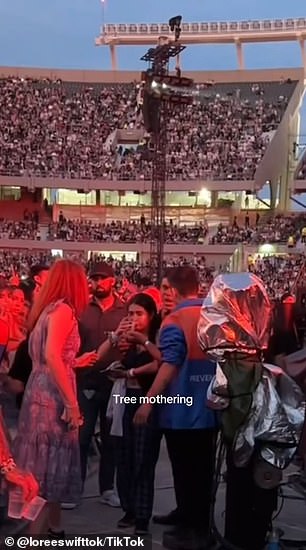 A girl was seen pouring water into the venue as fans suffered sweltering heat and dehydration