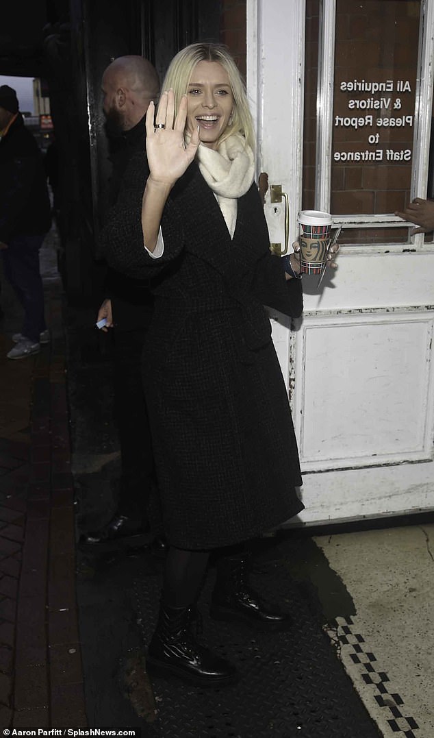 Caffeine kick: Nadiya fueled up with a Starbucks coffee as she headed to Blackpool Tower