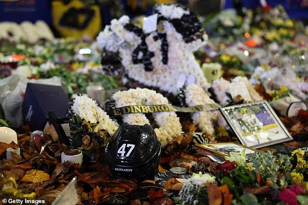 Johnson's helmet was also one of several flowers and photos placed outside the stadium