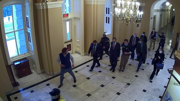 The footage shows members of Congress and staff members running to safety after the breach