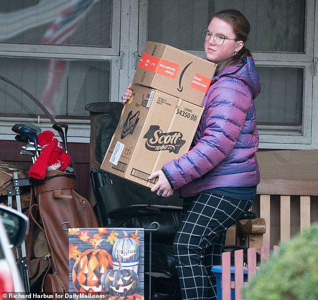 Victoria Heuermann seen clearing boxes from her family home in Massapequa, New York on November 10, 2023