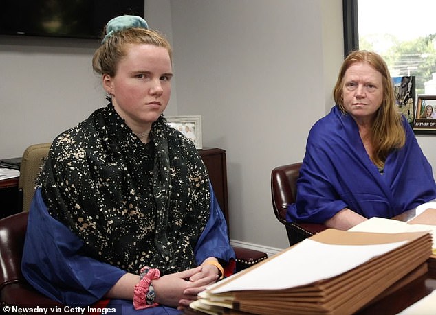 Ellerup (right) filed for divorce from Heuermann less than a week after Heuermann's arrest in July.  She is seen with daughter Victoria in their lawyer's office on July 31