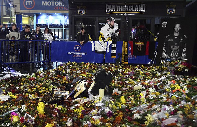 Flowers, cards and jerseys were left outside the venue as emotions ran high before the game