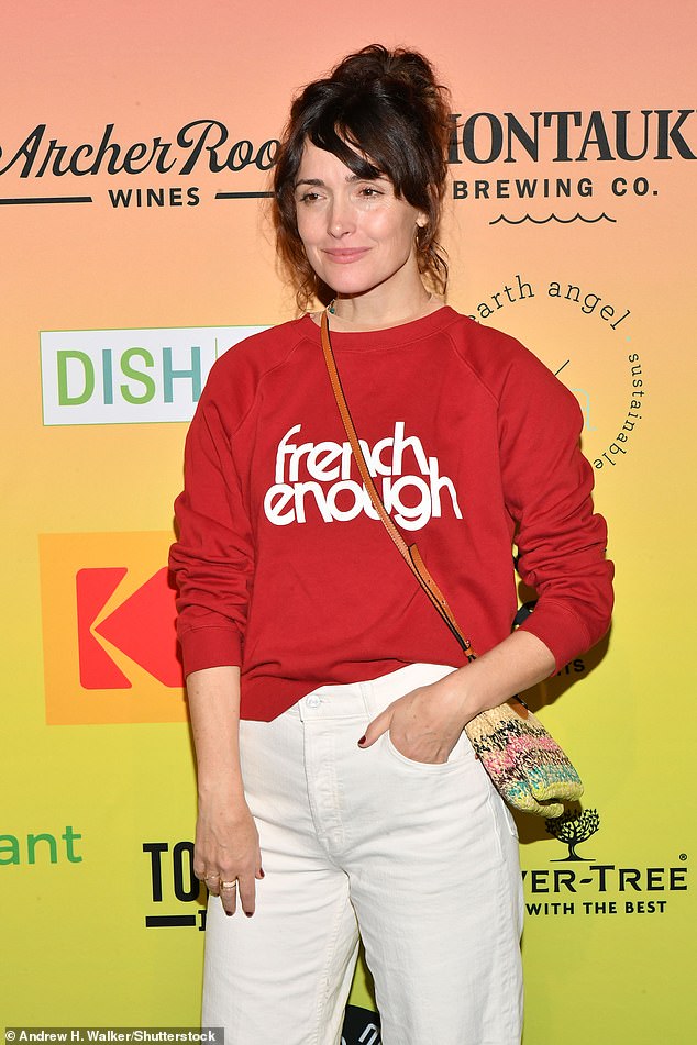 The Instant Family actress looked effortlessly chic in white trousers and a red sweater as she arrived at the event