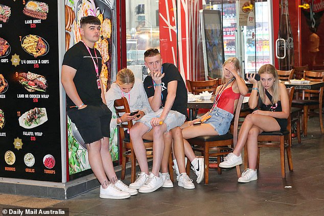 Not everyone at Schoolies is smiling all the time - these young people may have been tired