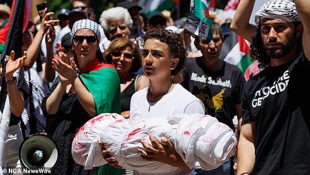 The Sydney rally, organized by the Palestine Action Group Sydney, met in Hyde Park at 1pm and demanded an end to what it called Israel's 'massacre' in Gaza.